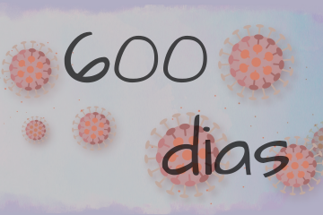 Ao fundo a imagem tem estilizado vários coronavírus, de diferentes tamanhos. à frente está escrito "600 dias" referindo-se aos 600 dias de pandemia de COVID-19